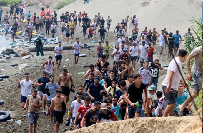 Spain’s prime minister rushes to defuse migrant crisis after 60,000 cross from Morocco in a single day